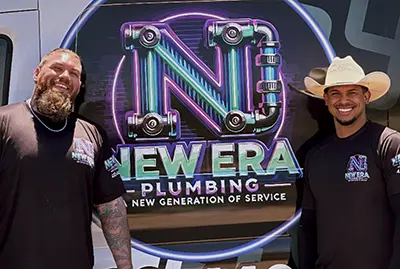 josh-and-louis-from-new-era-plumbing-in-mesa-arizona-standing-by-the-company-vehicle